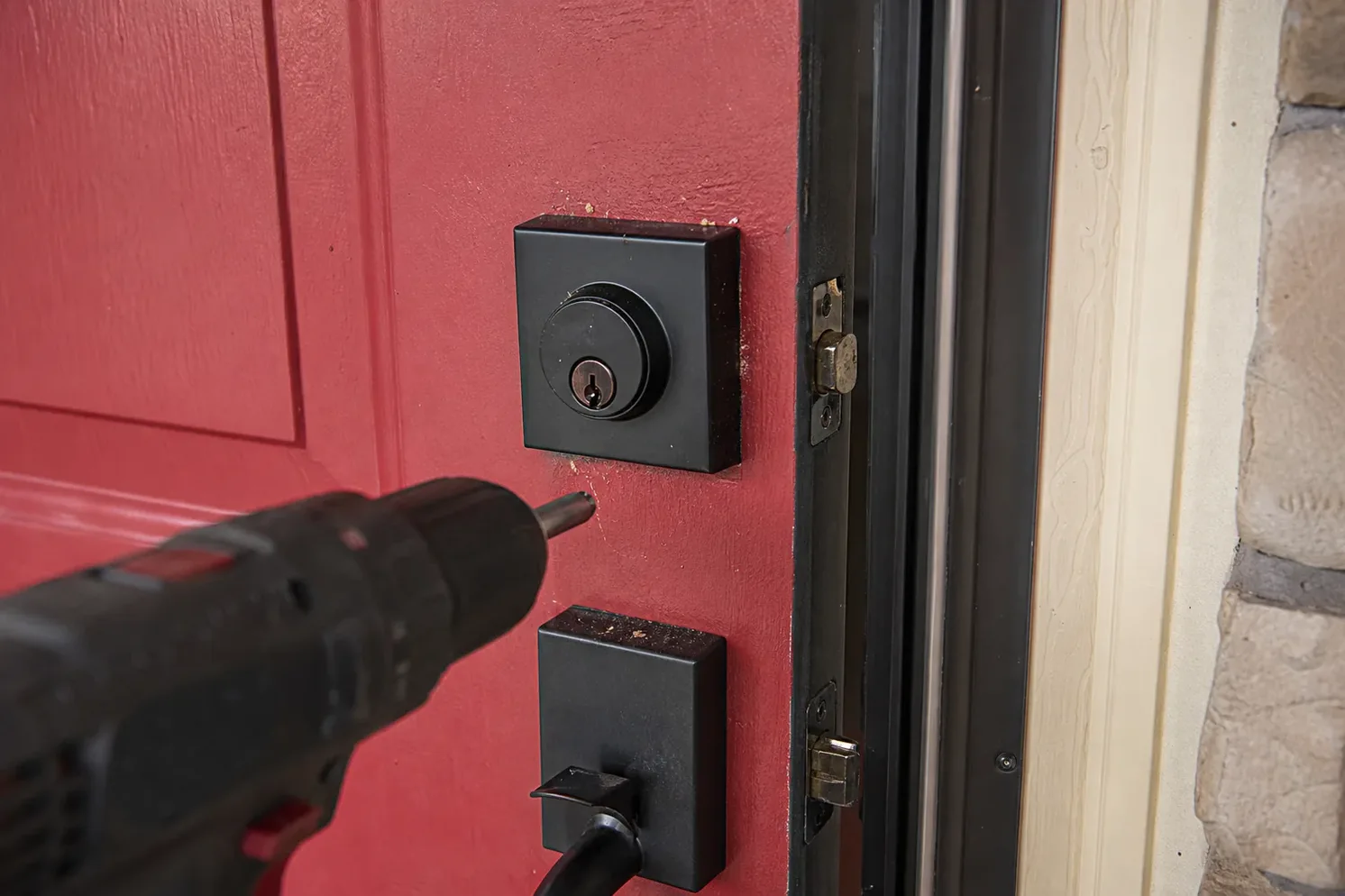 New deadbolt being installed in a front door